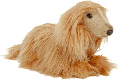 A plush toy dog lying down.