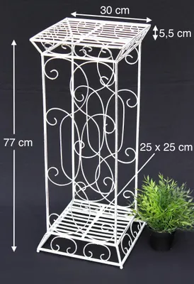 A white metal plant stand with decorative scrollwork is shown against a black background, with dimensions indicated by text overlays.