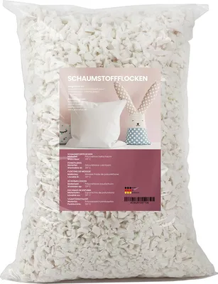 A large bag of white foam flakes, with a label showing a pillow and a stuffed bunny.