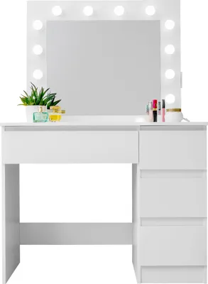 A white vanity table with a large mirror and lights, displaying some makeup and a plant.