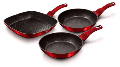 Three red frying pans and a grill pan are arranged on a white background.