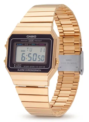 A close-up studio shot of a gold Casio digital watch on a white background.