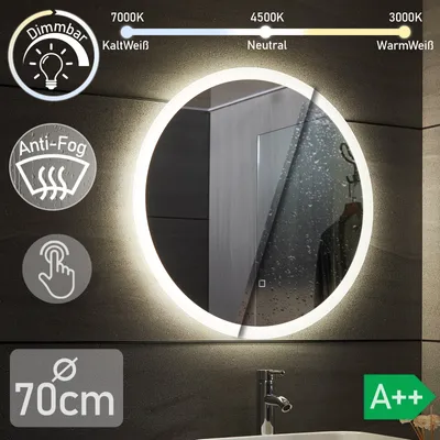 A circular LED bathroom mirror with various feature icons and text overlays, set against a dark, textured wall.