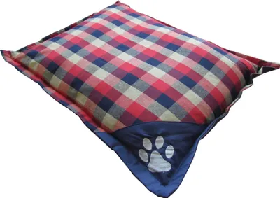A dog bed with a plaid pattern and a paw print logo.