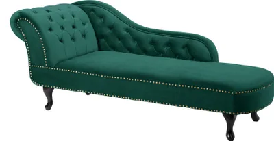 A green velvet chaise lounge with tufted back and nailhead trim, shown against a white background.