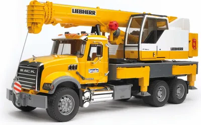 A toy model of a yellow Liebherr crane truck.
