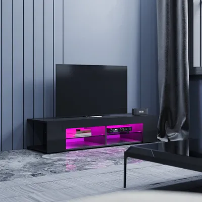 A modern living room with a black TV stand featuring LED lighting.