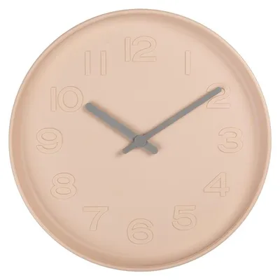 A pink wall clock with gray hands and embossed numbers.