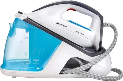 A steam ironing station with a water tank and iron on a white background.