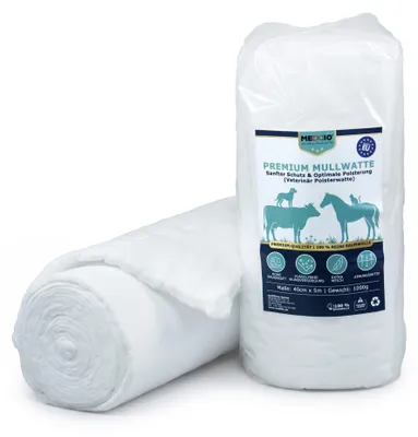Premium Mullwatte Verpackung stehend und eine weiche Rolle Polsterwatte liegend.