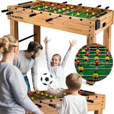 A family is playing foosball together.