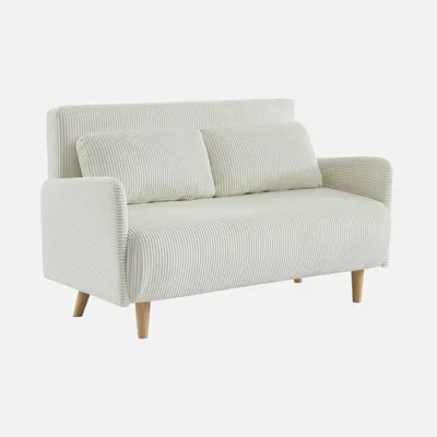 A white corduroy sofa with two pillows and wooden legs, presented on a plain white background.