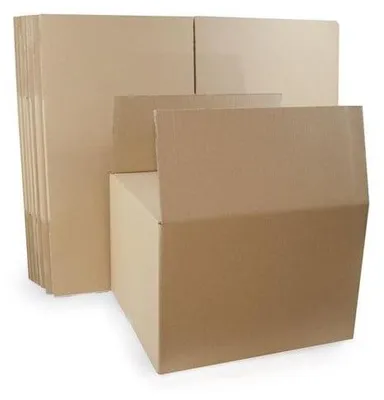 A stack of folded cardboard boxes and one assembled box.