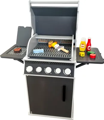 A toy grill with accessories on a white background.