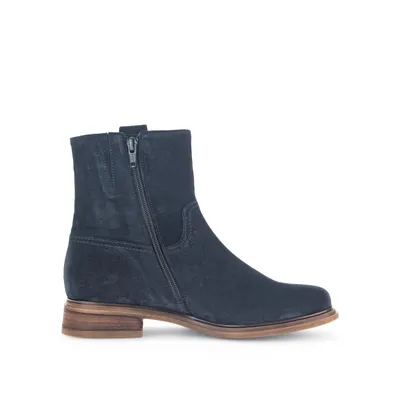 A single blue suede boot is shown against a white background.