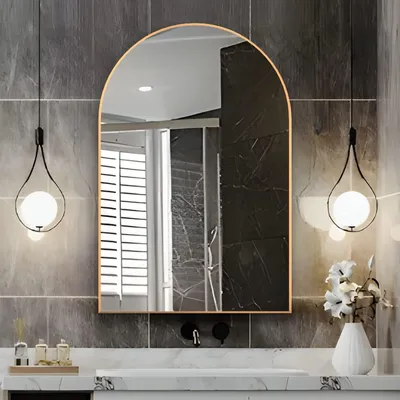 Image de Miroir mural incurvé doré pour salle de bain