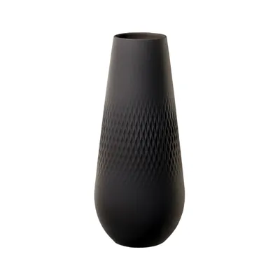 A black vase with a textured pattern.