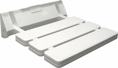 A white foldable shower seat mounted on a wall.
