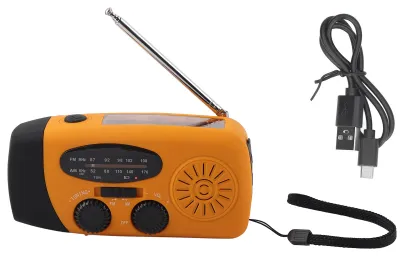 Zdjęcie produktu dla Radio słoneczne z korbką, wielofunkcyjne radio awaryjne z diodą LED i latarką, idealne do użytku na zewnątrz i podczas biwaków. Kolor: pomarańczowy. Produkt przeznaczony na rynek europejski