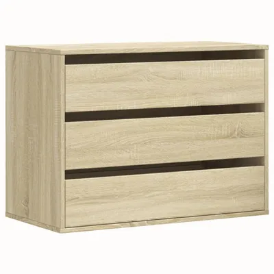 A chest of drawers with three drawers, made of wood-look material.