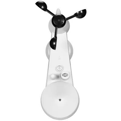 A top-down view of a white weather station with black anemometer cups.