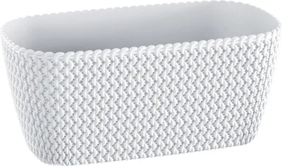 A white planter with a knitted texture.