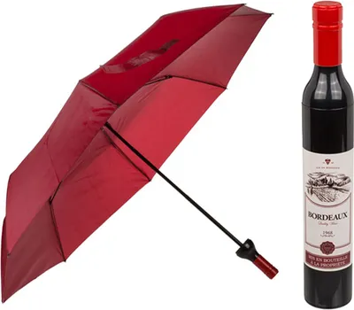 A red umbrella is shown partially open next to a dark red wine bottle.