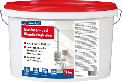 A white plastic bucket with a red lid, containing adhesive for wallpaper and fiberglass.
