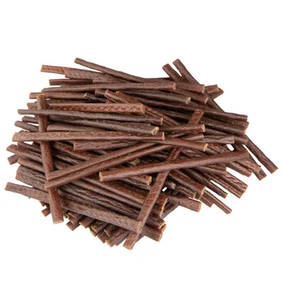A pile of brown, stick-shaped dog treats.