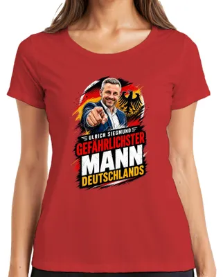Immagine prodotto di Maglietta da donna, colore rosso, taglia XL, con la scritta "Ulrich Siegmund: l'uomo più pericoloso" e un'espressione sarcastica, tema: politica