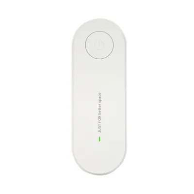 A white, oval-shaped electronic device with a power button symbol on top and text printed vertically on its surface.