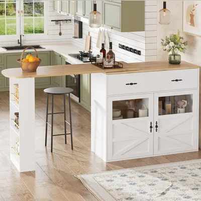 A kitchen island with a breakfast bar extension, stools, and kitchen cabinets in the background.
