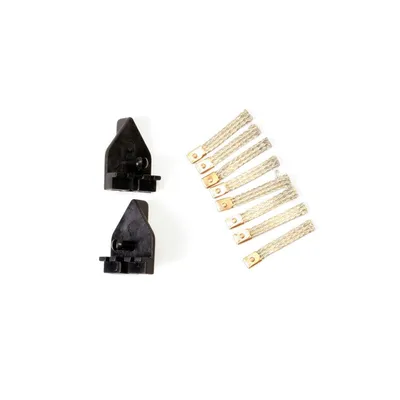 Two black plastic components and a group of braided metal strips with gold connectors are arranged on a white background.