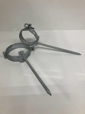 Two metal pipe clamps with spikes are shown on a white background.