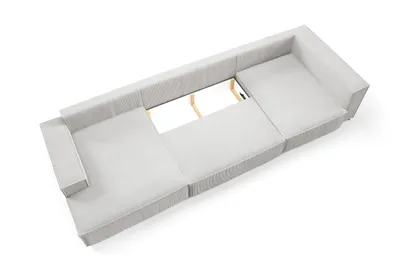 An overhead view of a sectional sofa with its storage compartment open.