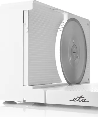 Close-up of a white electric food slicer.