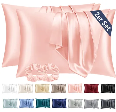 Produktbild von Set mit 2 Satin-Kissenbezügen, 40 x 80 cm, rosa, seidenweich und pflegeleichter als Seidenkissenbezüge. Inklusive 2 Haargummis.