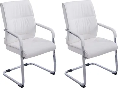 Two white cantilever chairs are shown against a white background.