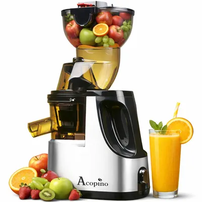 A slow juicer is shown with a glass of juice and surrounding fruits.