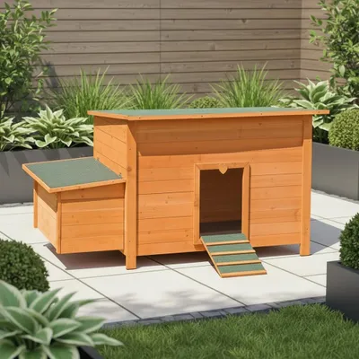 A wooden chicken coop with a green roof and ramp, set on a paved patio with surrounding greenery.