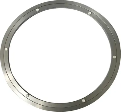 A circular metal turntable bearing with small white plastic feet is shown against a white background.