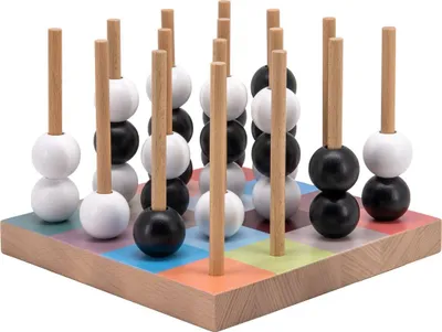A wooden game with black and white balls on wooden pegs.
