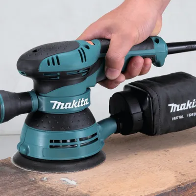Produktbild von Makita BO5041 Profi-Elektro-Exzenterschleifer, 300 Watt, 125 mm Schleiffläche, variable Geschwindigkeit, Staubabsaugung