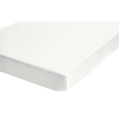 A close-up view of a white fitted sheet, showing the corner seam.
