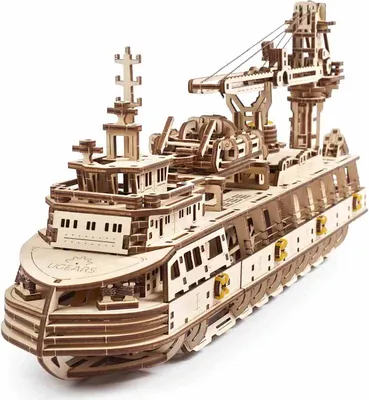 A 3D wooden model of a research ship with a crane.