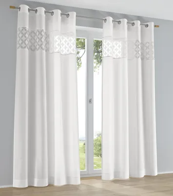 Curtains hanging in front of a window.