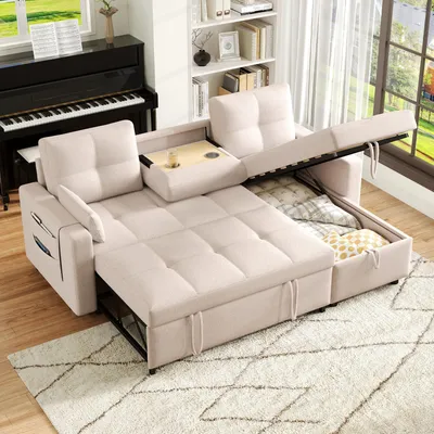 A beige sectional sofa is shown in a living room setting, with a piano and bookshelf in the background.