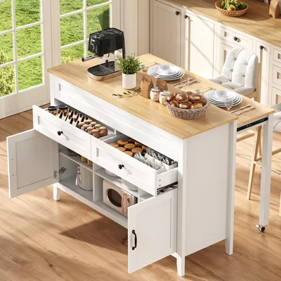 Immagine prodotto di Isola da cucina STILVORA con tavolo da pranzo estensibile e piano di lavoro, mobile da cucina con 2 cassetti suddivisi e ante, credenza da cucina con ripiani a giorno