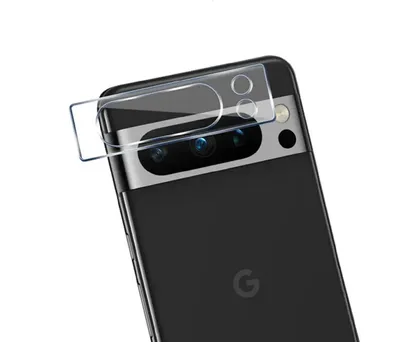 A close-up shot of the rear camera module of a black Google Pixel smartphone, with a clear screen protector being applied.