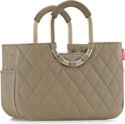 A studio shot of a quilted tote bag with metal handles.